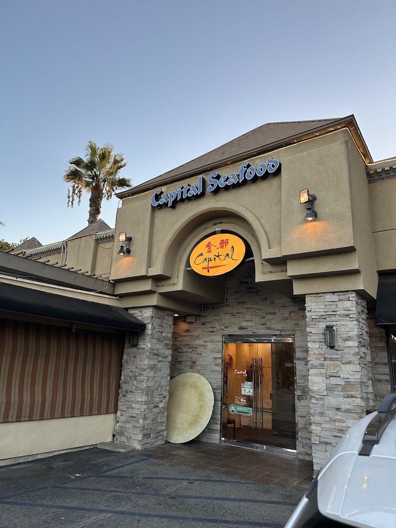 Restaurant entrance with bold signage above glass doors.
