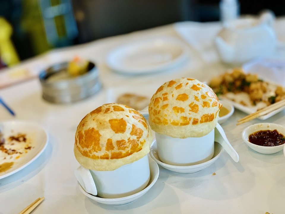Menu spread showing soups, appetizers, and family meals.